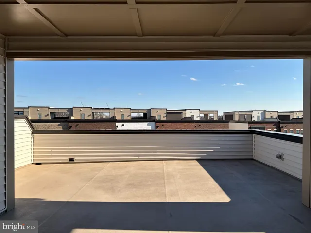 a view of kitchen island with granite countertop