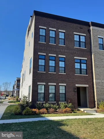 a front view of building with yard