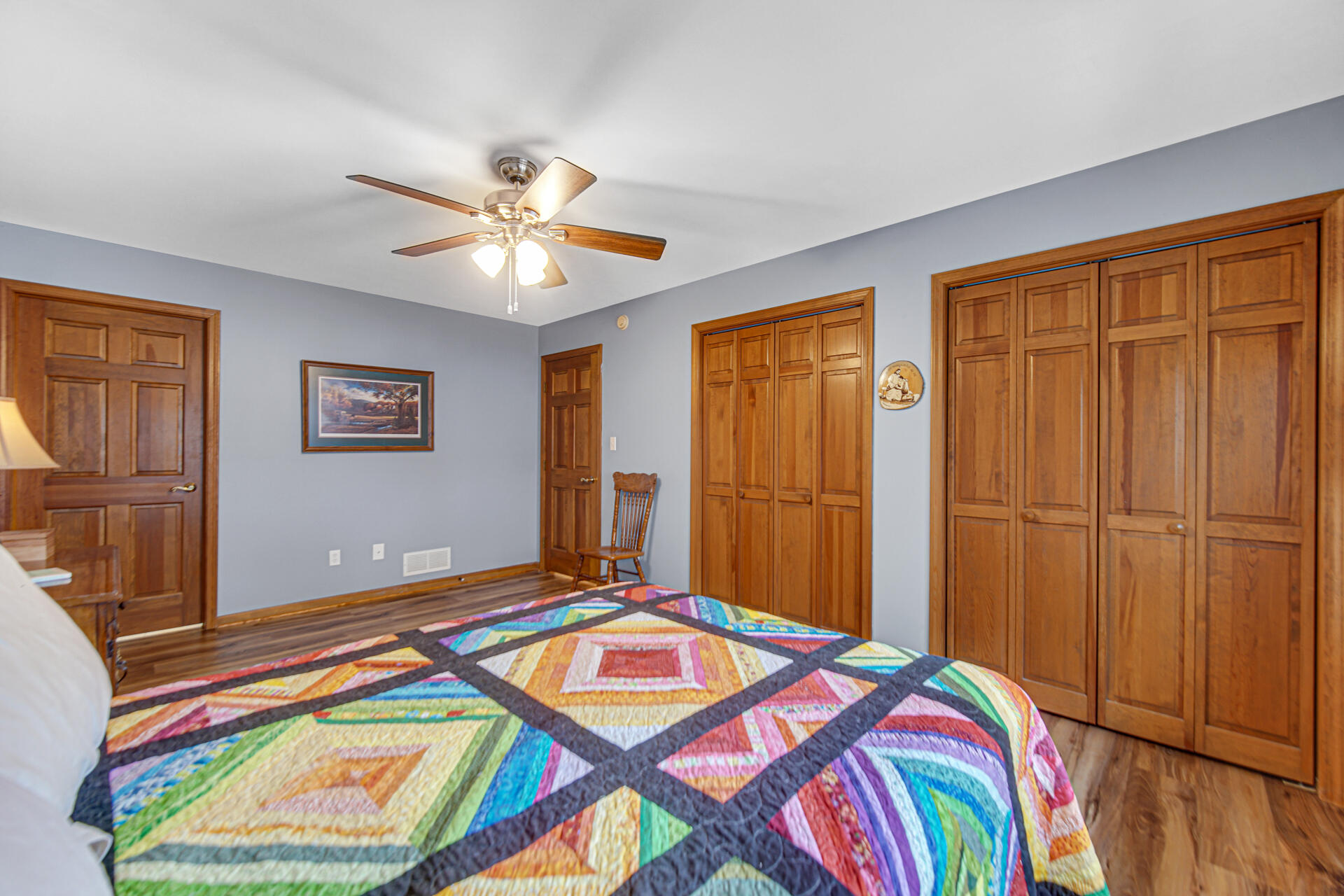 9320 Spring Creek Drive, Unit 3 Highland, IN 46322 - Photo 12 of 26 a bedroom with a bed and a chandelier