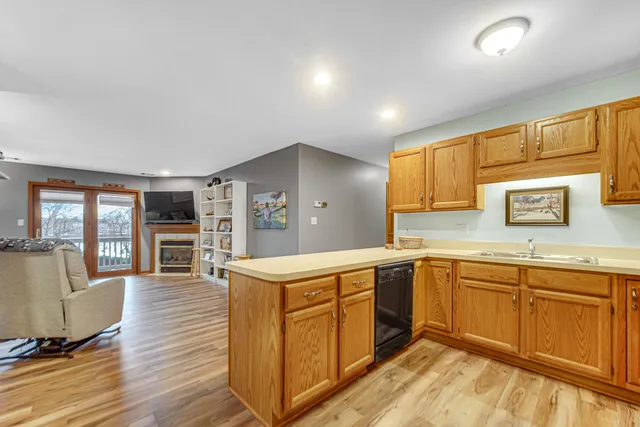 a kitchen with wooden cabinets and sink