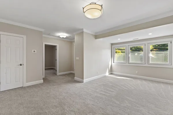 a view of an empty room with a window