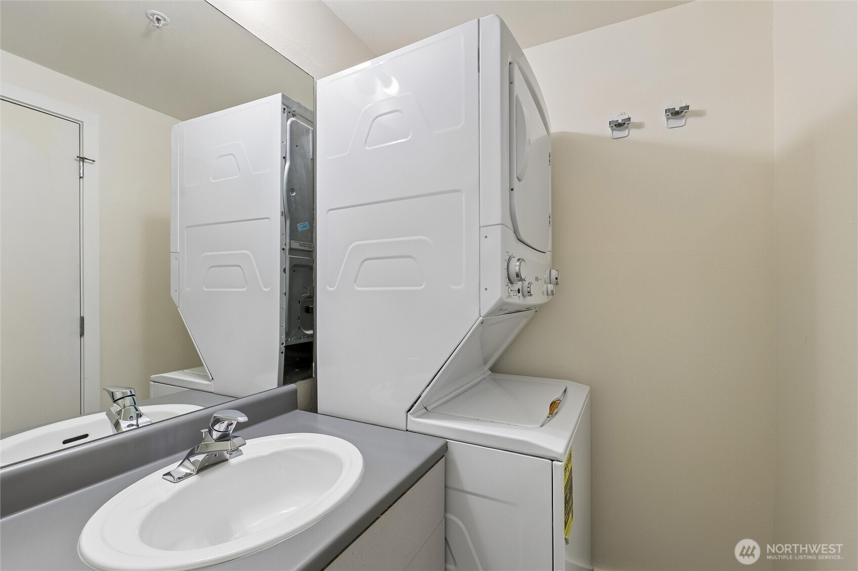 66 Bell Street, Unit 23 Seattle, WA 98121 - Photo 18 of 24 a bathroom with a sink and a mirror