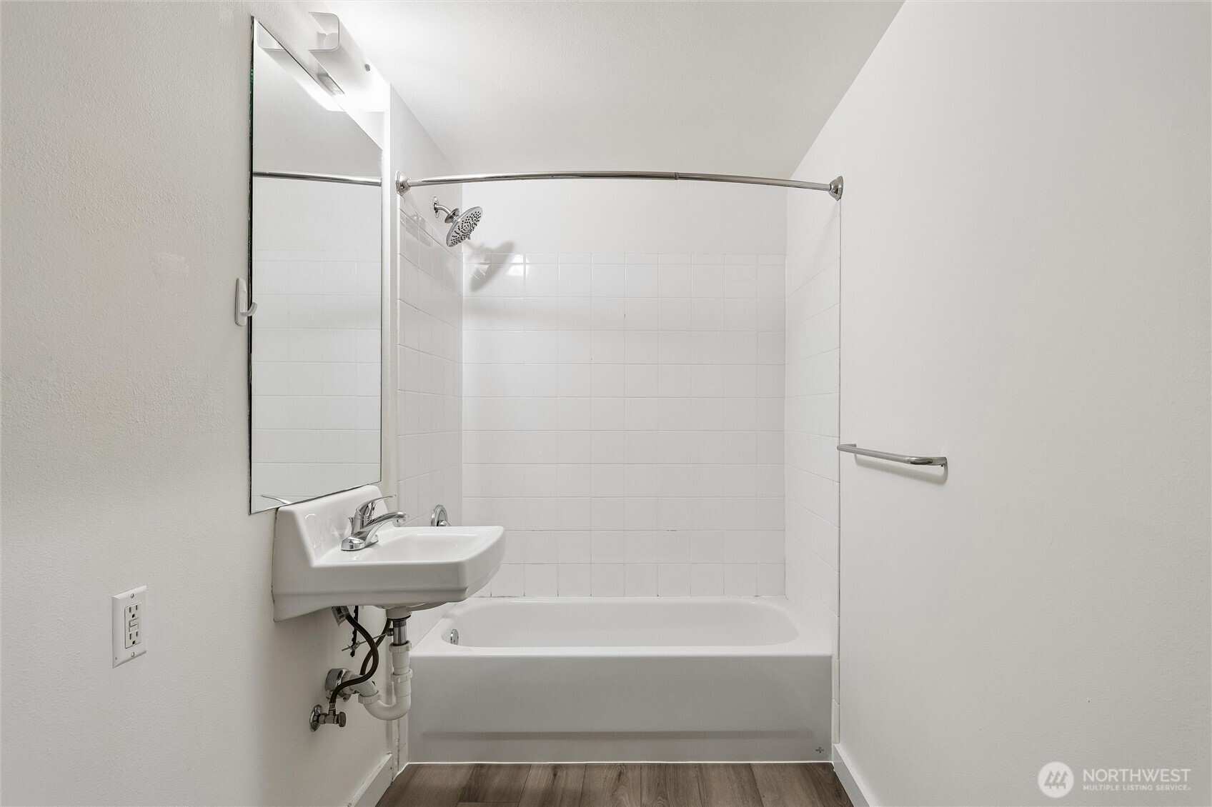 66 Bell Street, Unit 23 Seattle, WA 98121 - Photo 22 of 24 a bathroom with a shower and a sink