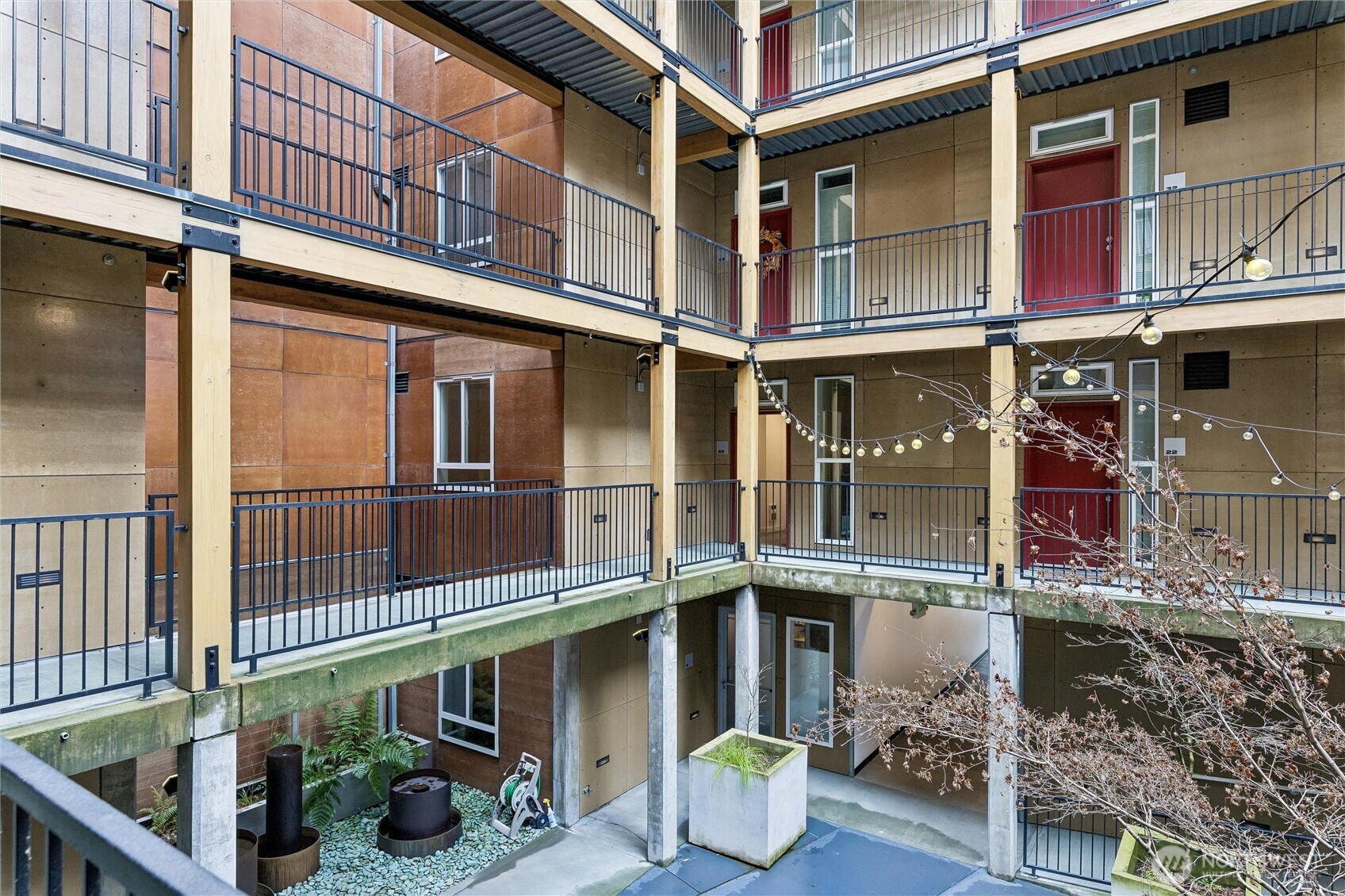 66 Bell Street, Unit 23 Seattle, WA 98121 - Photo 23 of 24 a front view of a building with street