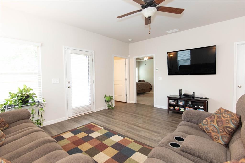 103 Prominence Court Canton, GA 30114 - Photo 13 of 34 a living room with furniture and a flat screen tv