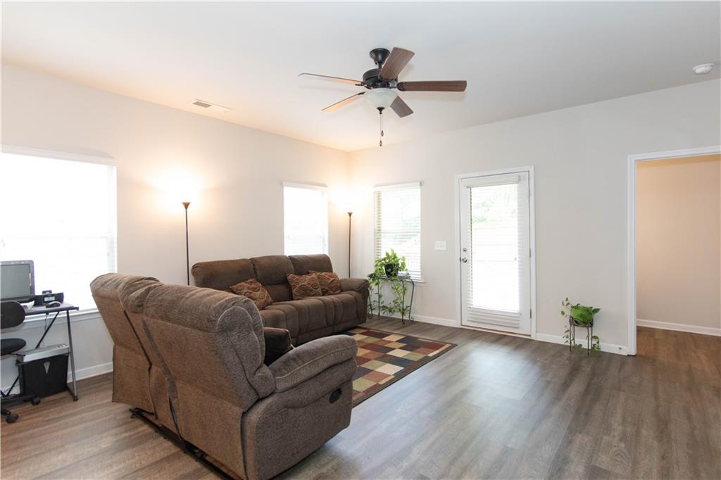 103 Prominence Court Canton, GA 30114 - Photo 15 of 34 a living room with furniture and wooden floor