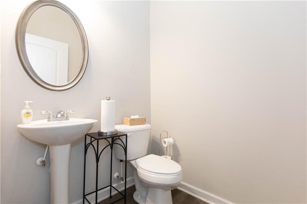 103 Prominence Court Canton, GA 30114 - Photo 16 of 34 a bathroom with a sink a toilet and a mirror