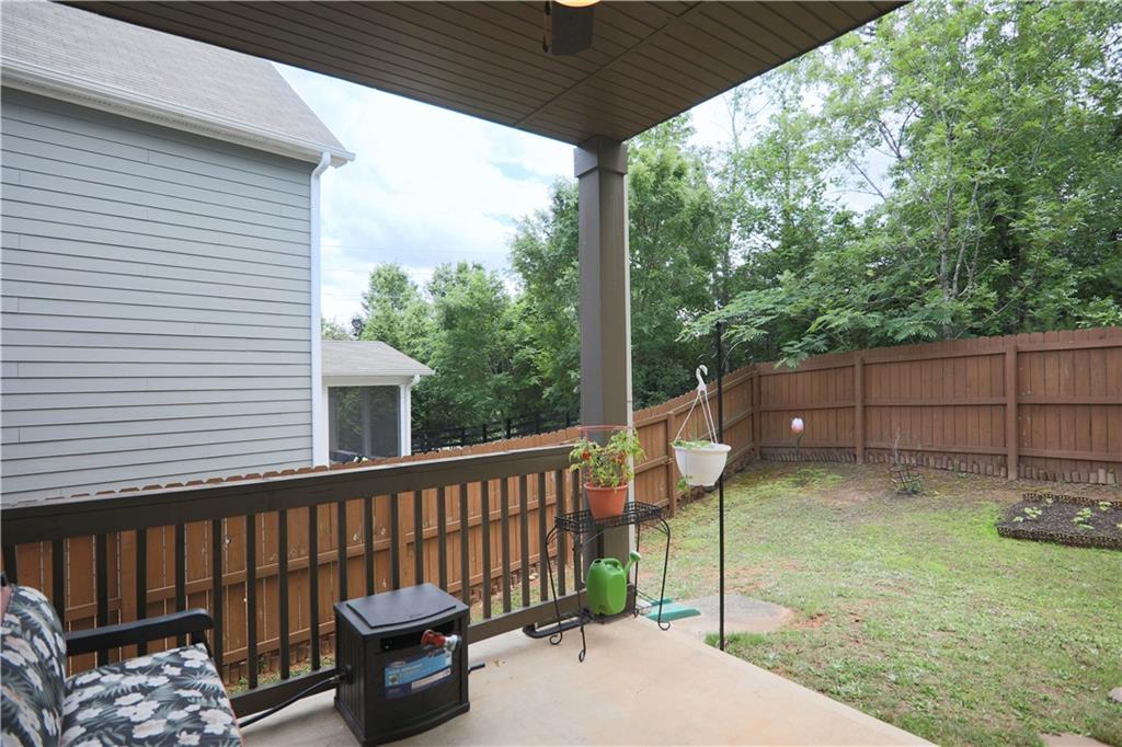 103 Prominence Court Canton, GA 30114 - Photo 27 of 34 a view of a deck with a table and chairs