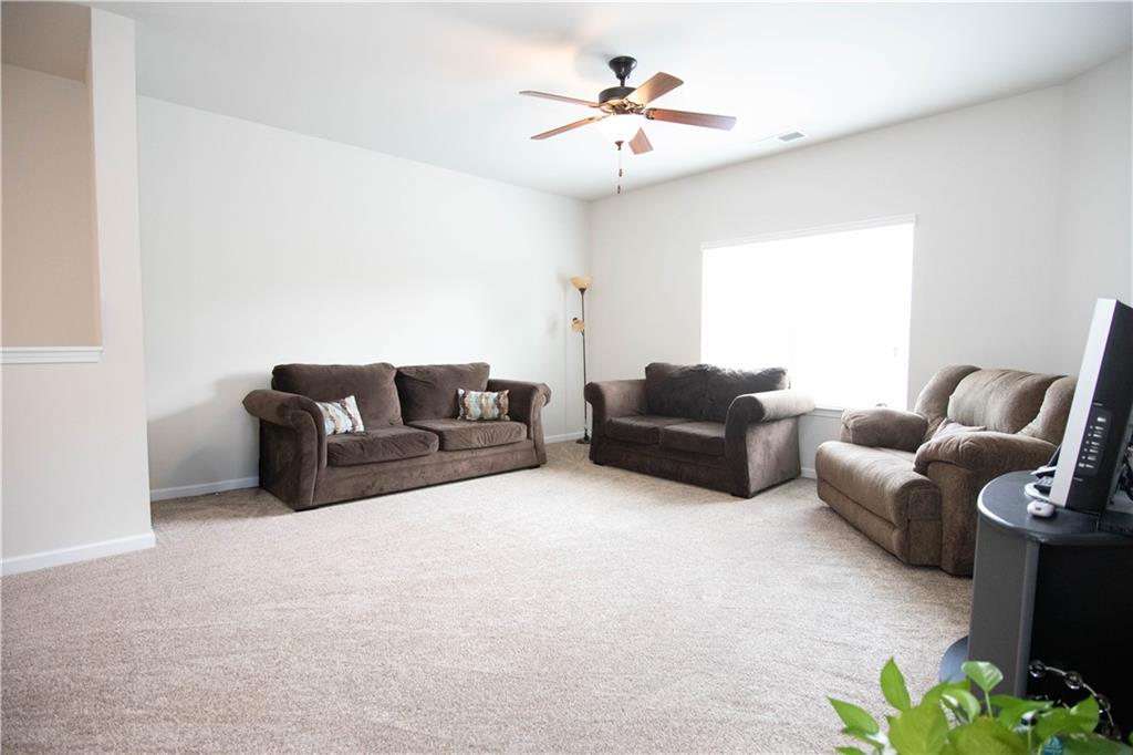 103 Prominence Court Canton, GA 30114 - Photo 30 of 34 a living room with furniture