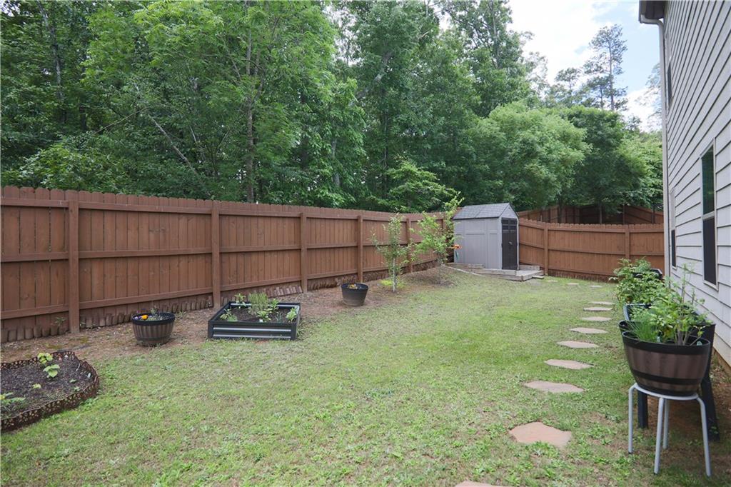 103 Prominence Court Canton, GA 30114 - Photo 32 of 34 a backyard of a house with seating space