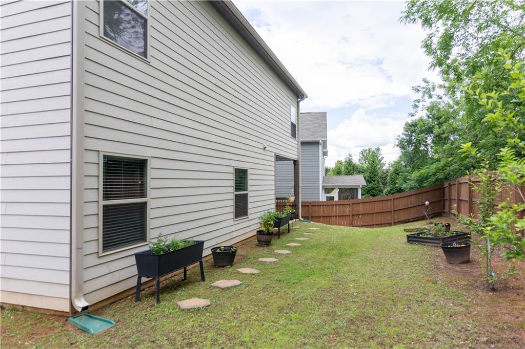 103 Prominence Court Canton, GA 30114 - Photo 34 of 34 a view of a house with backyard and sitting area