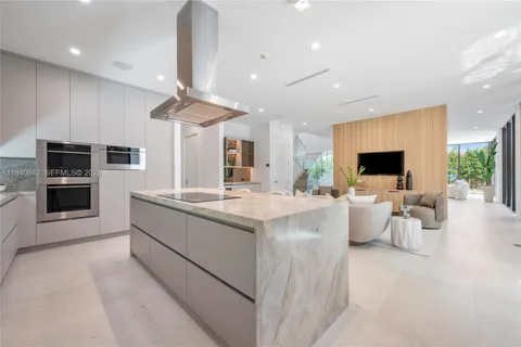 a bedroom with double bed windows and painting on the wall
