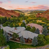 an aerial view of residential houses with outdoor space and river