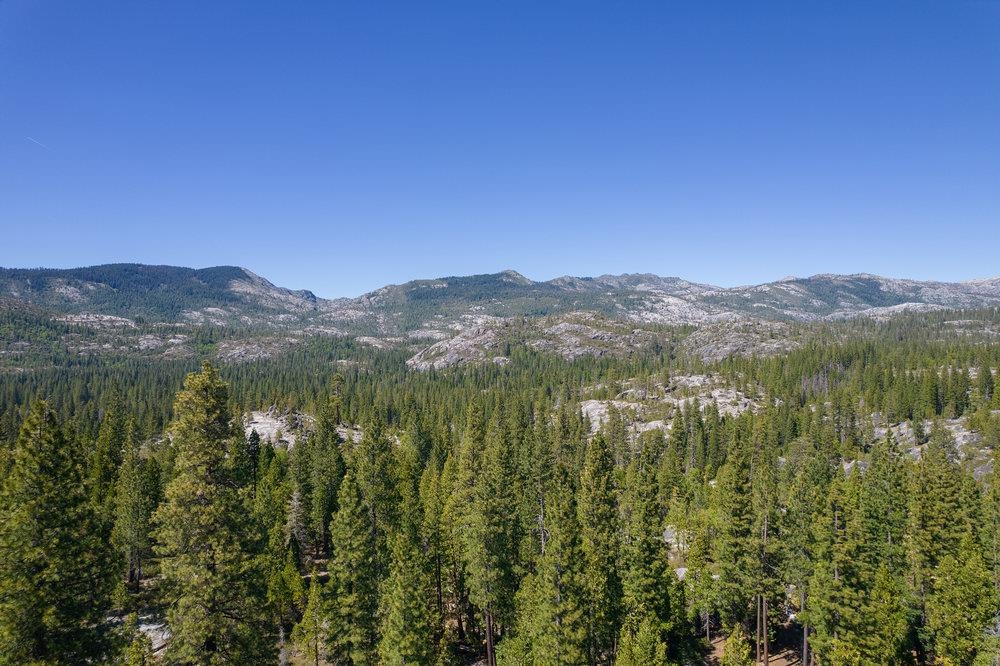 a view of a town with mountains in the background