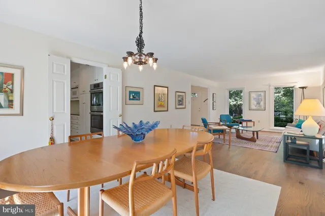 a kitchen with stainless steel appliances granite countertop a sink dishwasher and cabinets with wooden floor