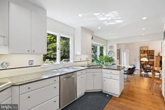 a kitchen with a table and chairs in it