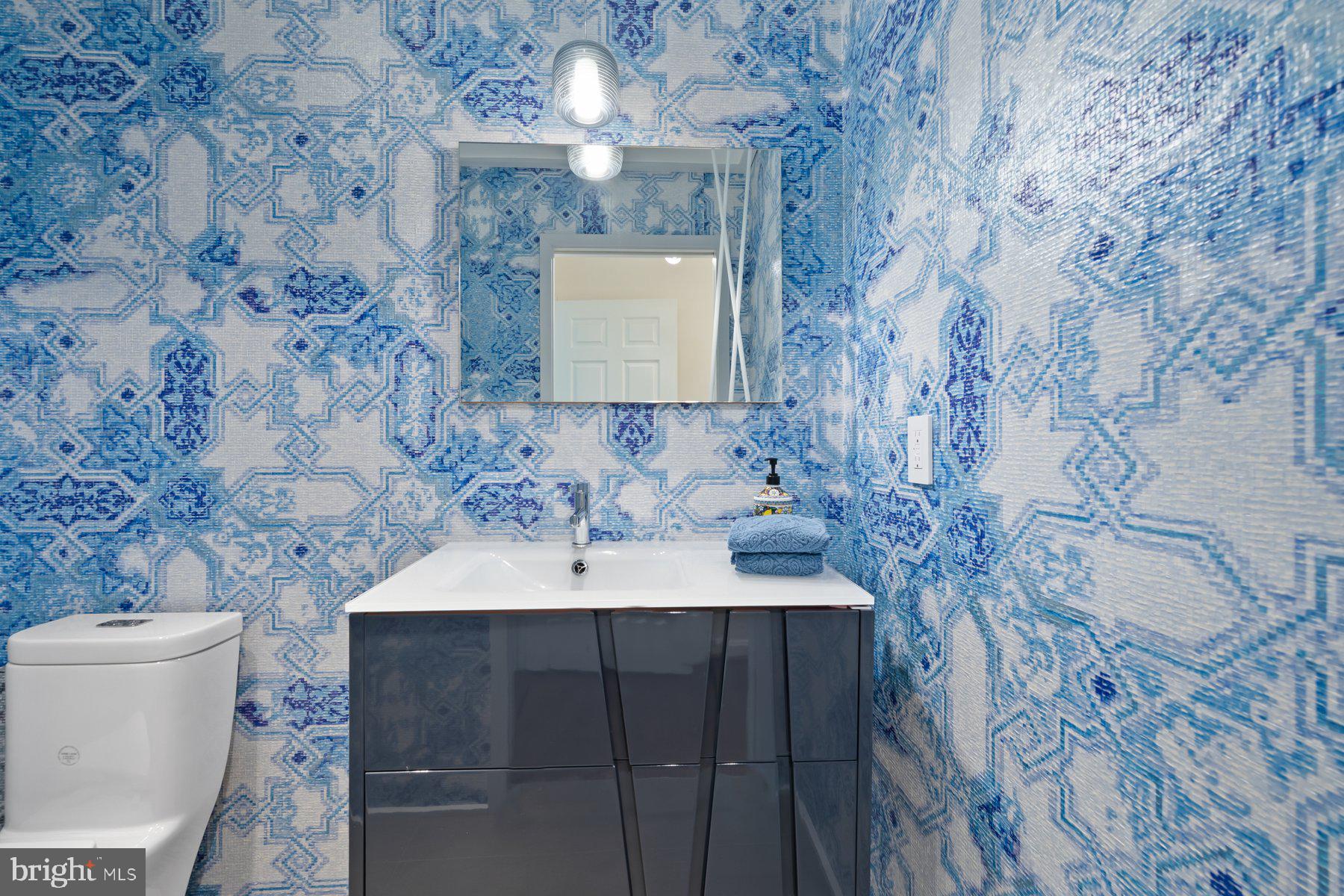 16400 Montecrest Lane Gaithersburg, MD 20878 - Photo 25 of 58 a bathroom with a sink and a toilet