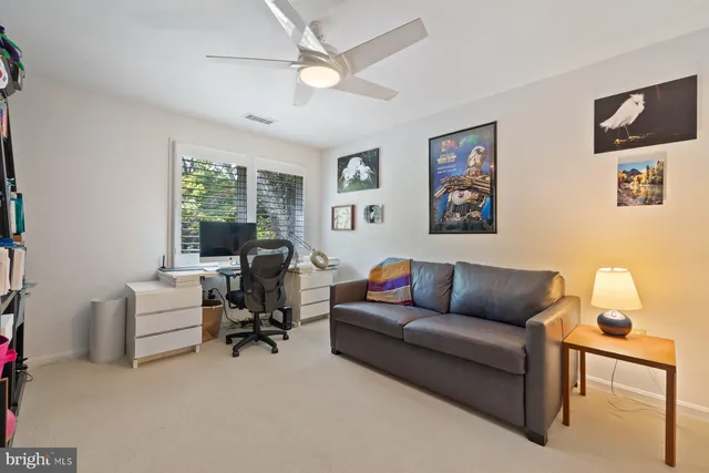 a bedroom with furniture and windows
