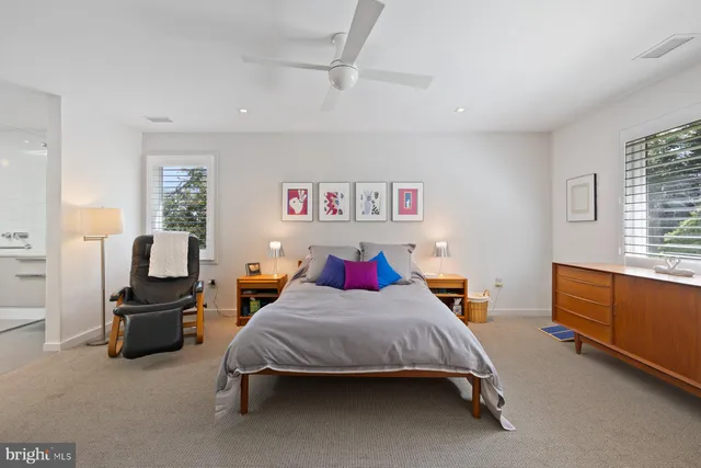 a bathroom with a sink a large mirror and a shower