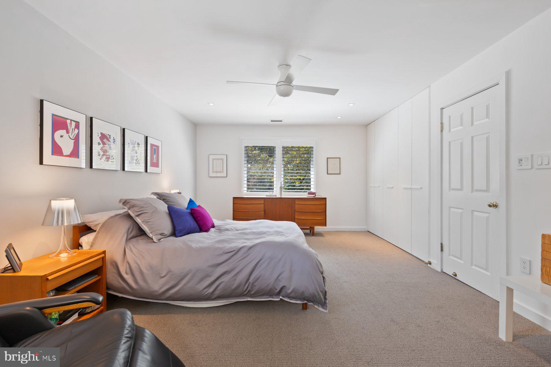 16400 Montecrest Lane Gaithersburg, MD 20878 - Photo 38 of 58 a bedroom with a bed and wooden floor
