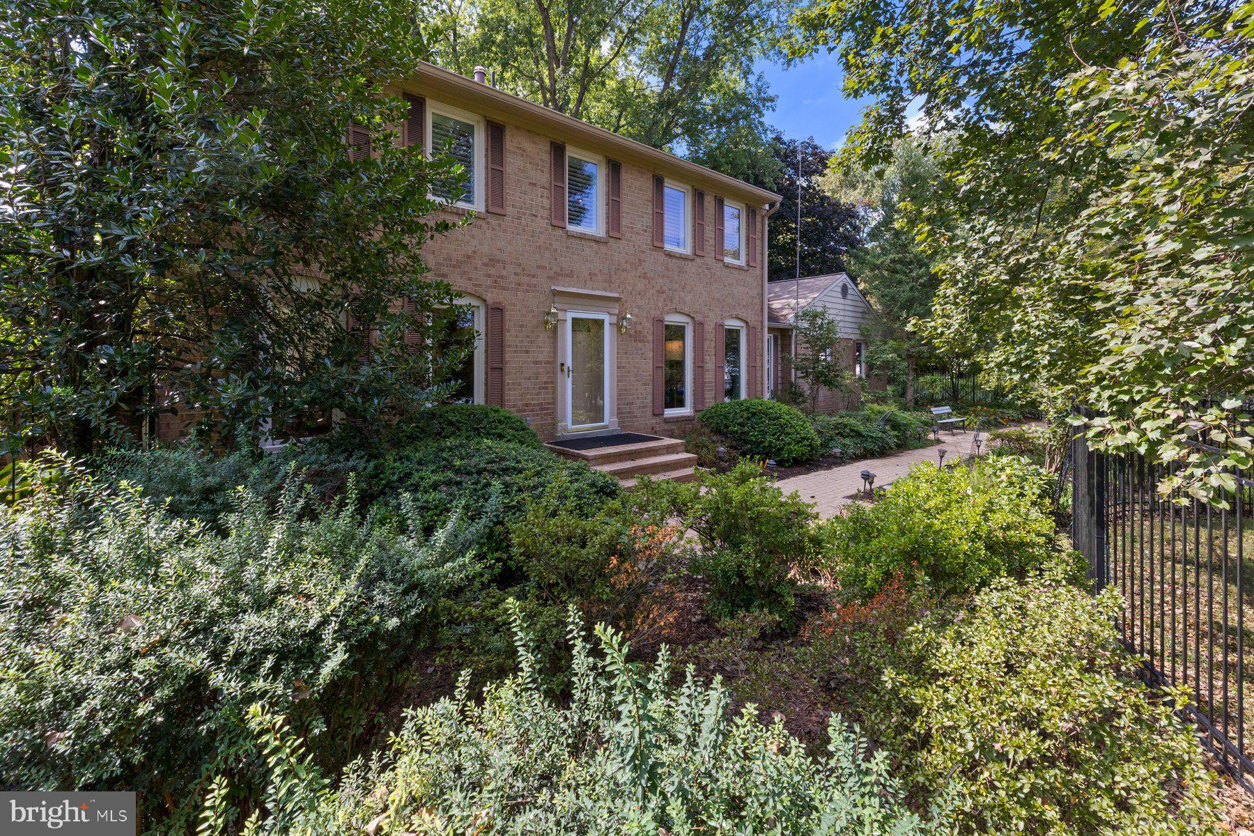 16400 Montecrest Lane Gaithersburg, MD 20878 - Photo 5 of 58 a front view of a house with garden