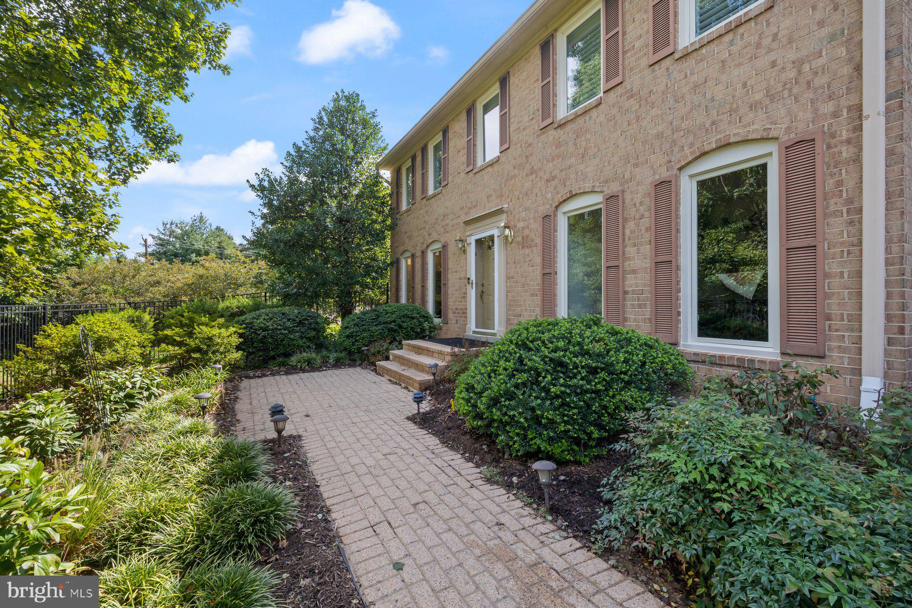 16400 Montecrest Lane Gaithersburg, MD 20878 - Photo 6 of 58 a view of a pathway both side of house