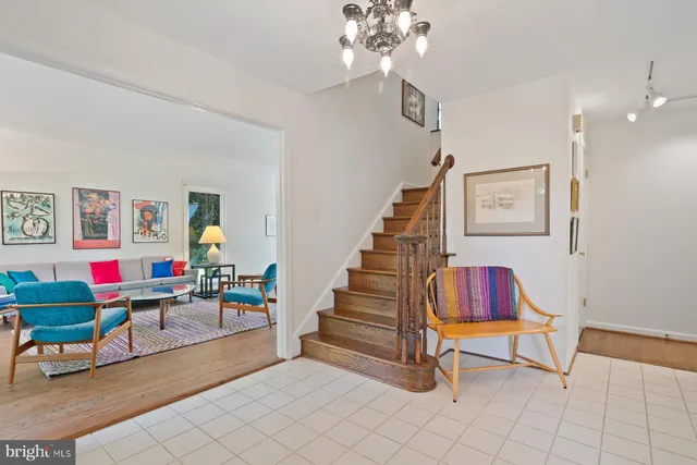 a living room with furniture and a rug