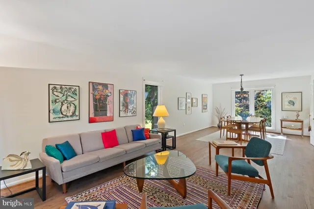 a living room with furniture and a table