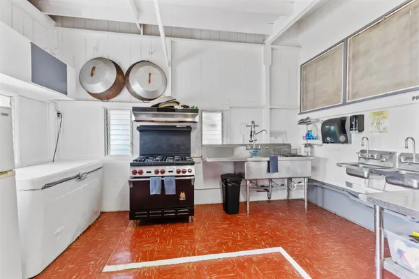 a kitchen with cabinets and steel stainless steel appliances