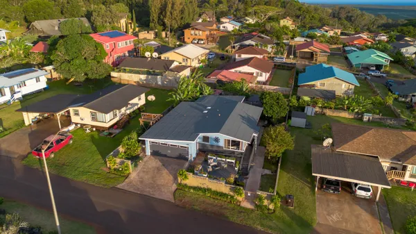 an aerial view of residential houses with outdoor space