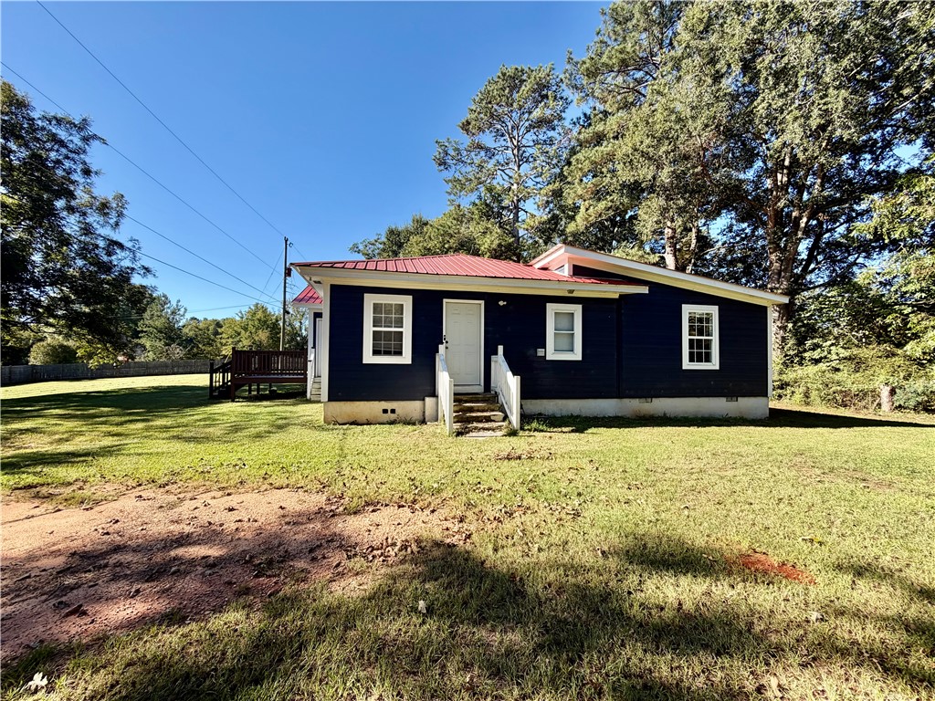 242 Taylor Town Road Abbeville, SC 29620 - Photo 2 of 9 A classic metal roof protects this charming siding home surrounded by a grassy lawn.