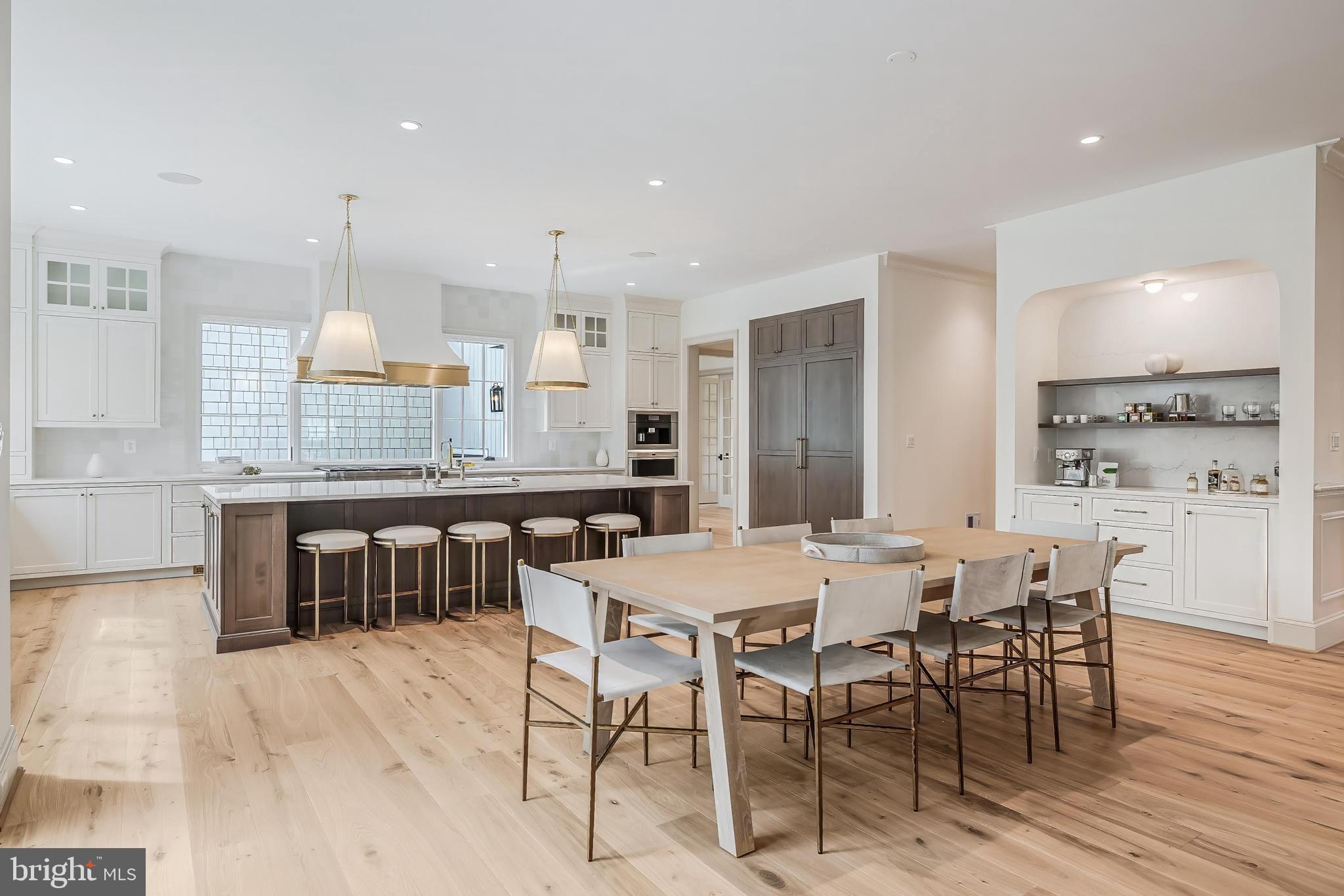 6913 Benjamin Street McLean, VA 22101 - Photo 20 of 51 a large kitchen with a table and chairs