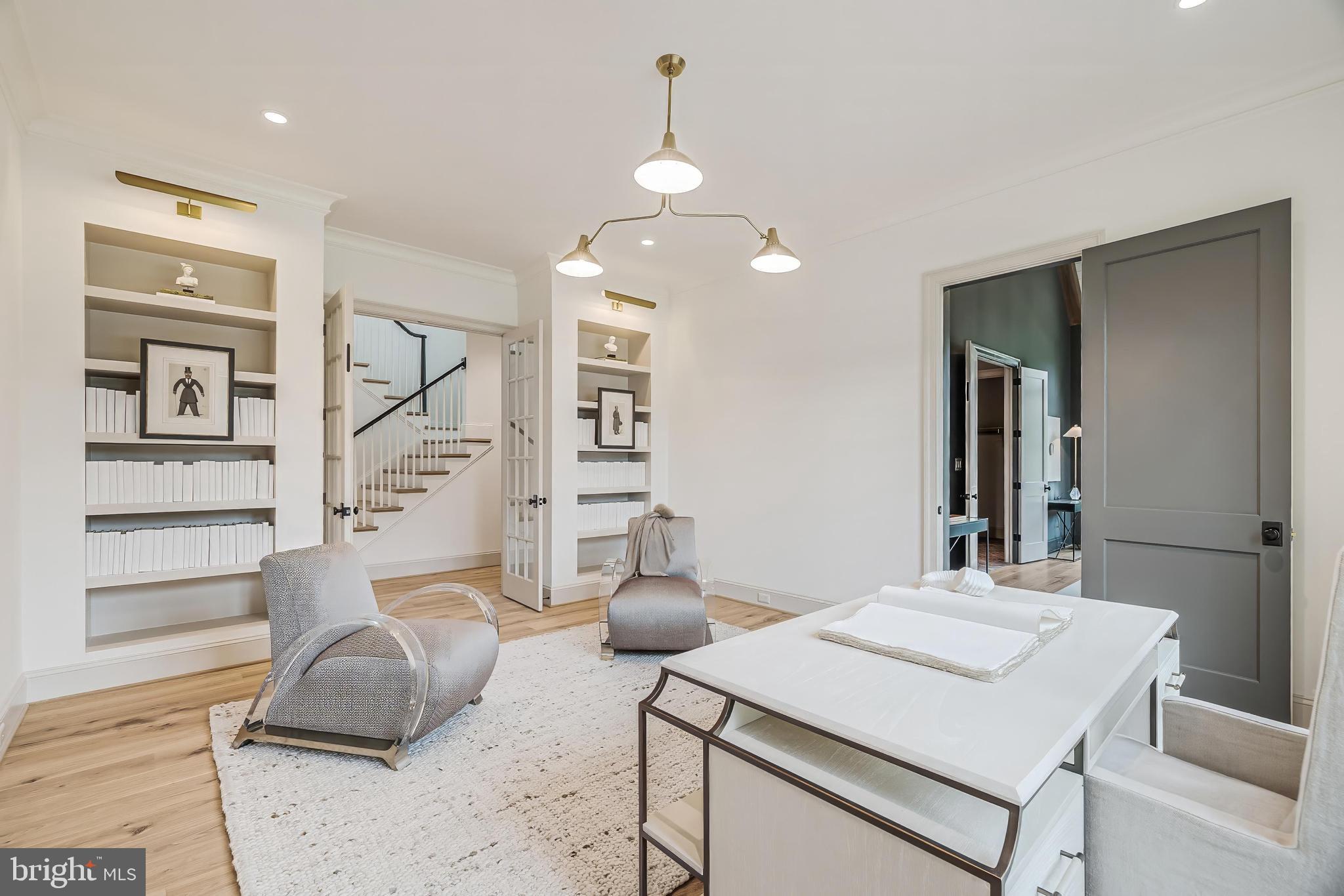 6913 Benjamin Street McLean, VA 22101 - Photo 26 of 51 a room with table chairs and wooden floor