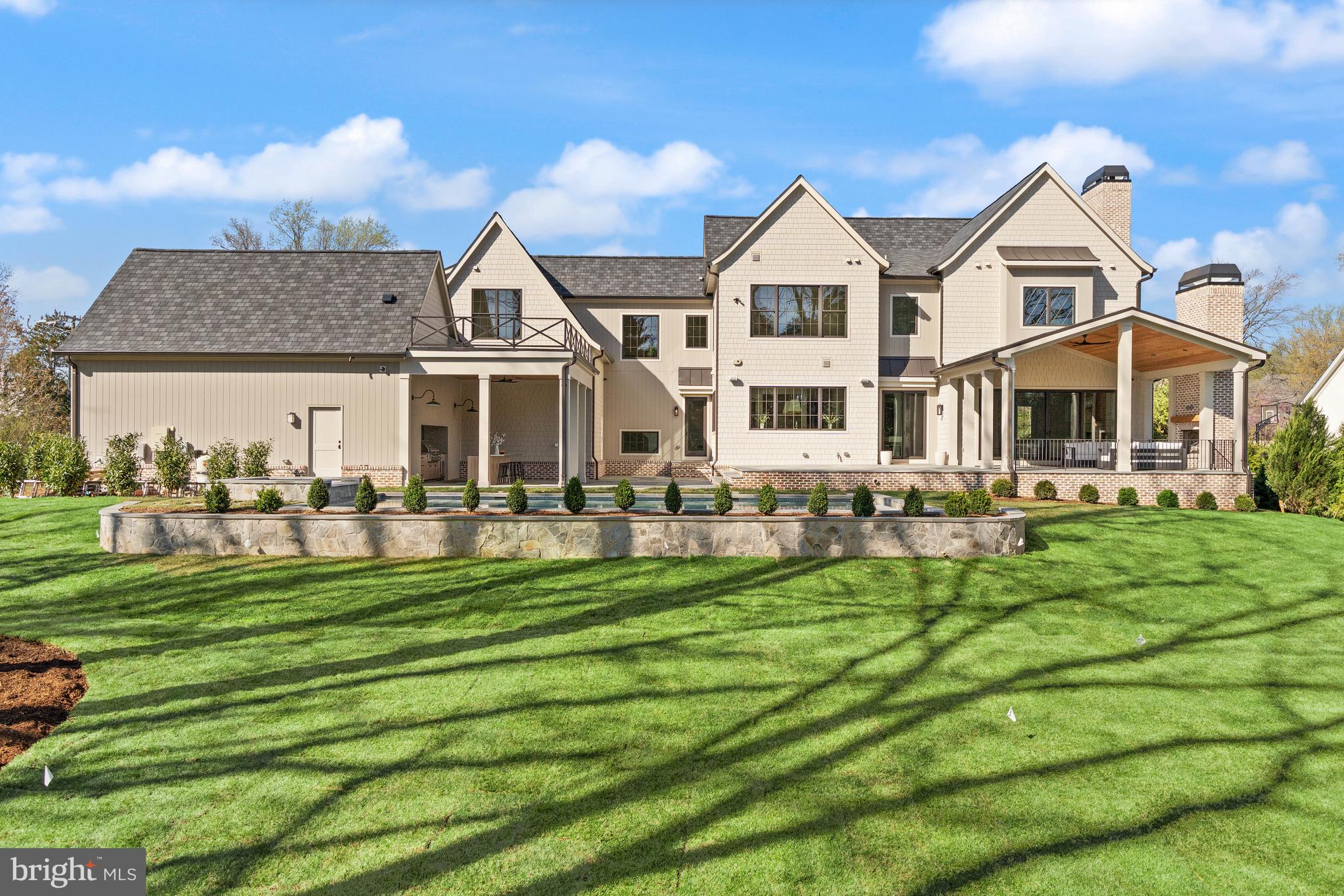 6913 Benjamin Street McLean, VA 22101 - Photo 3 of 51 a front view of a house with a garden