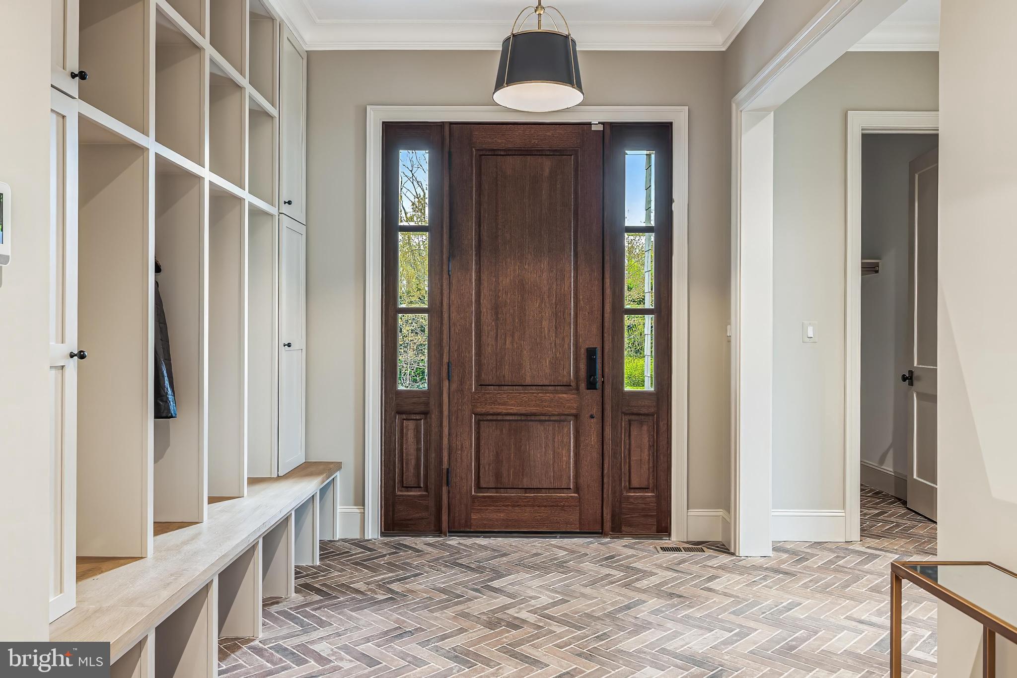 6913 Benjamin Street McLean, VA 22101 - Photo 31 of 51 a view of a hallway with wooden floor and staircase
