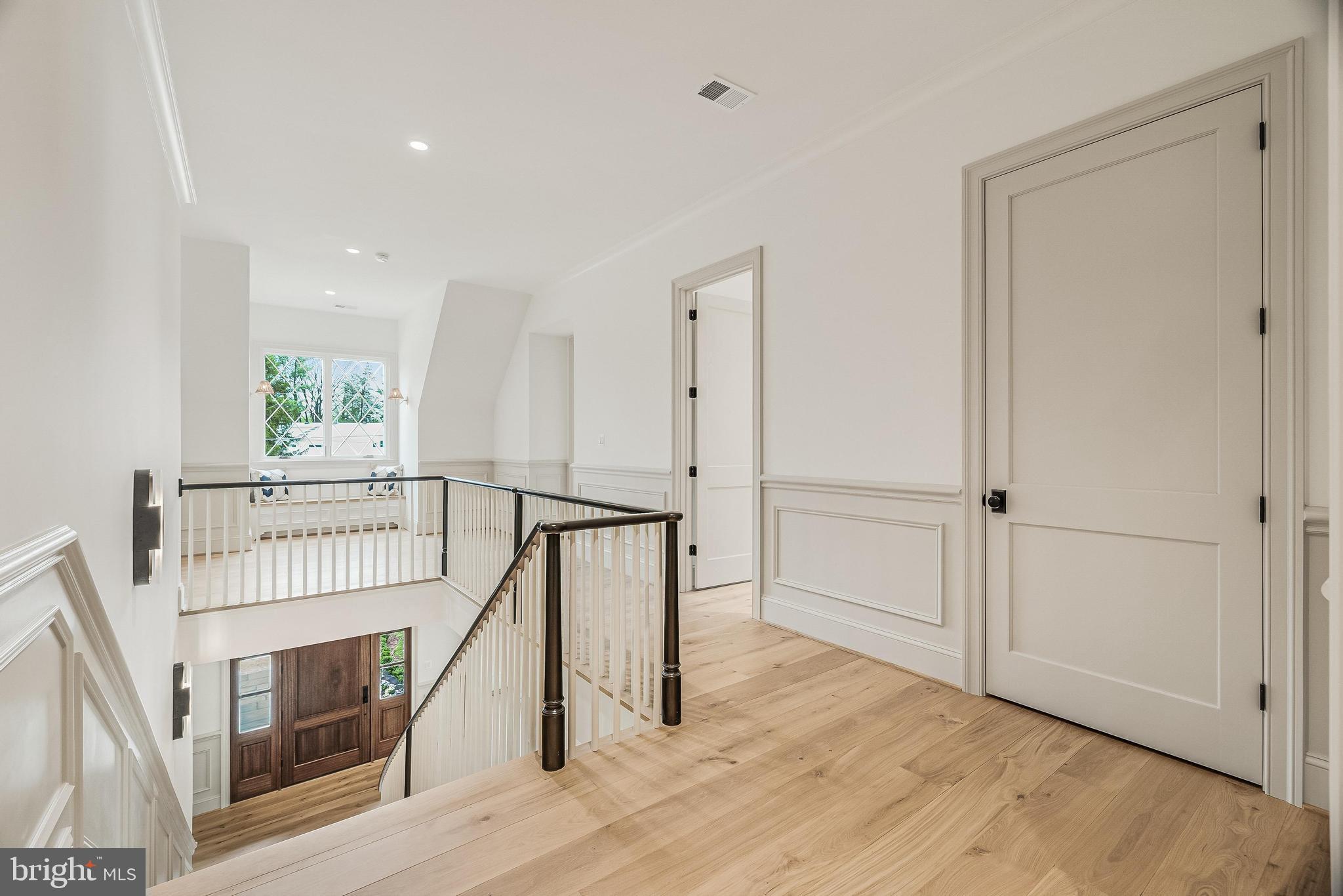 6913 Benjamin Street McLean, VA 22101 - Photo 34 of 51 a view of an entryway with wooden floor