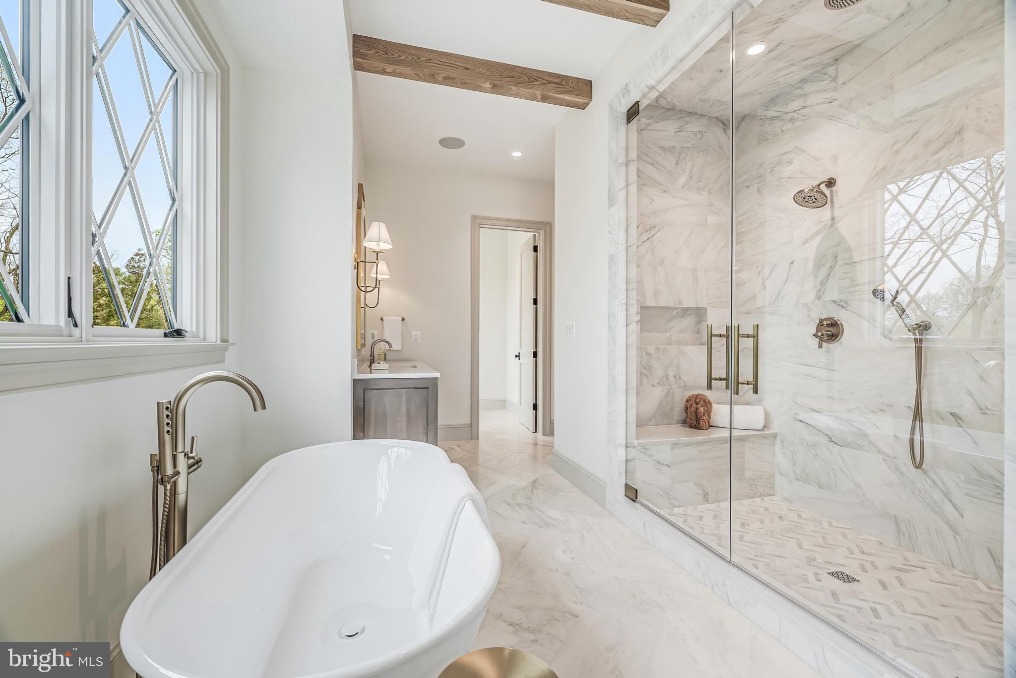 6913 Benjamin Street McLean, VA 22101 - Photo 38 of 51 a bathroom with a sink and shower