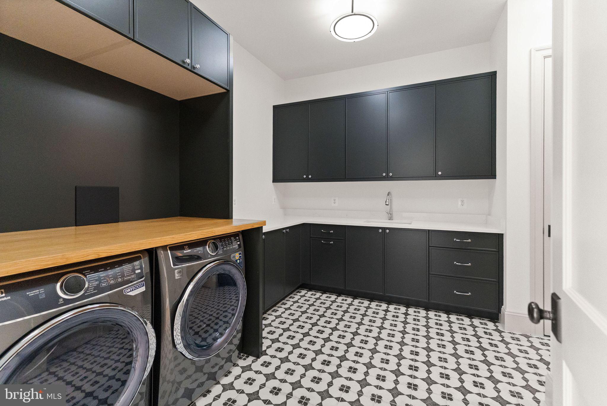 6913 Benjamin Street McLean, VA 22101 - Photo 41 of 51 a bathroom with a sink a vanity and a mirror