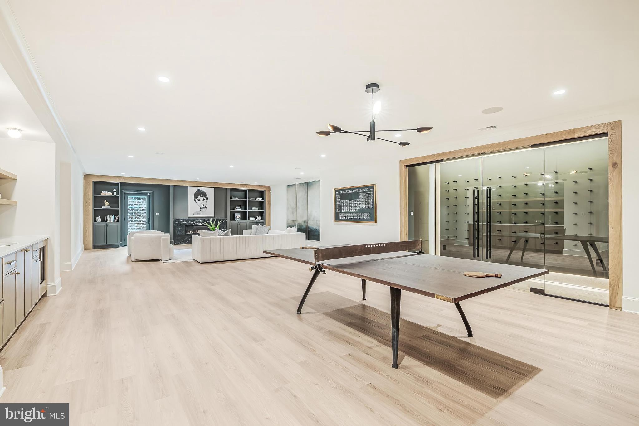 6913 Benjamin Street McLean, VA 22101 - Photo 43 of 51 a living room with furniture a table and a large window