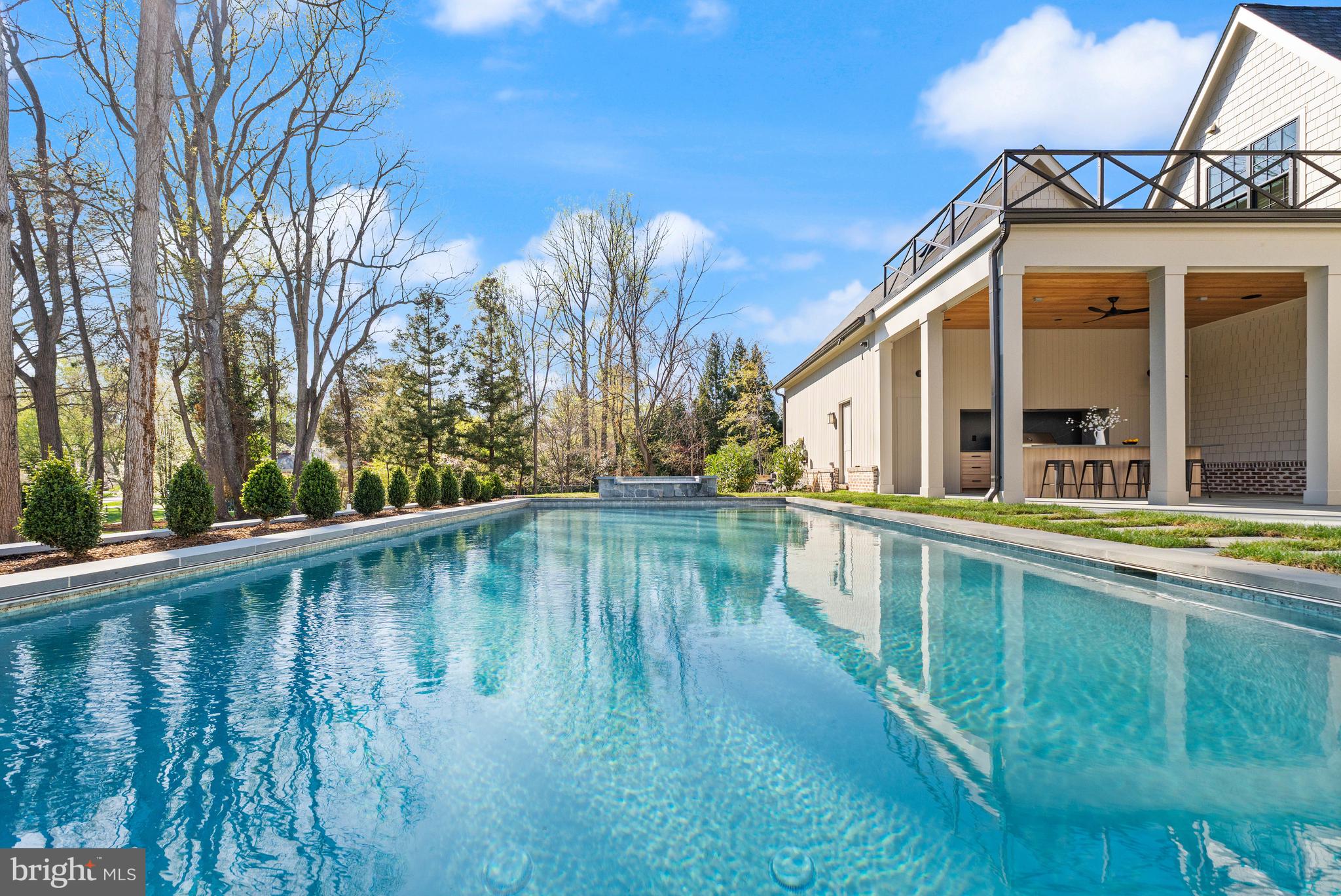 6913 Benjamin Street McLean, VA 22101 - Photo 46 of 51 a view of a house with pool and sitting area