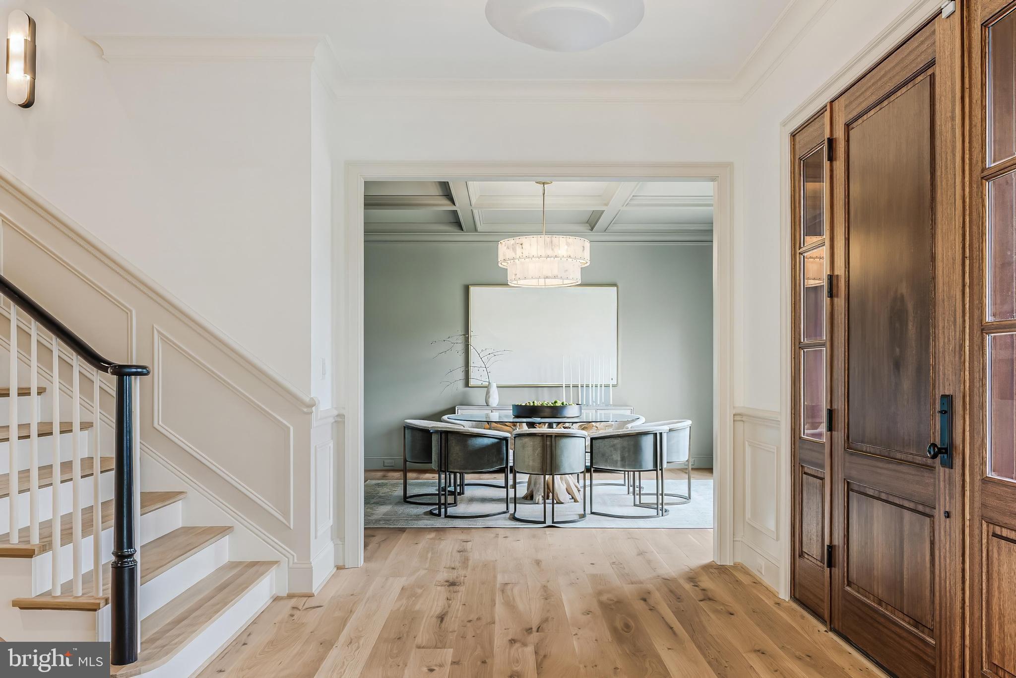 6913 Benjamin Street McLean, VA 22101 - Photo 5 of 51 a view of a hallway with wooden floor and staircase