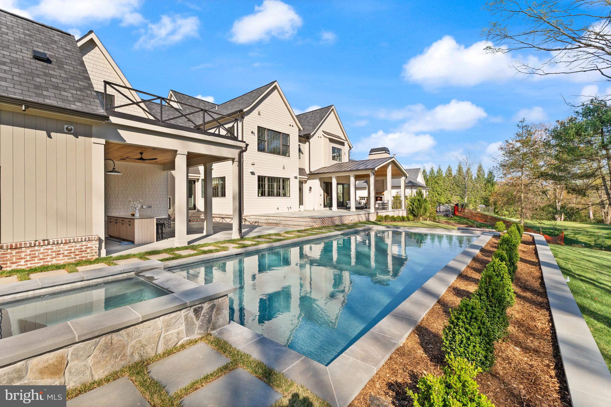 6913 Benjamin Street McLean, VA 22101 - Photo 51 of 51 a view of a house with pool and ocean view