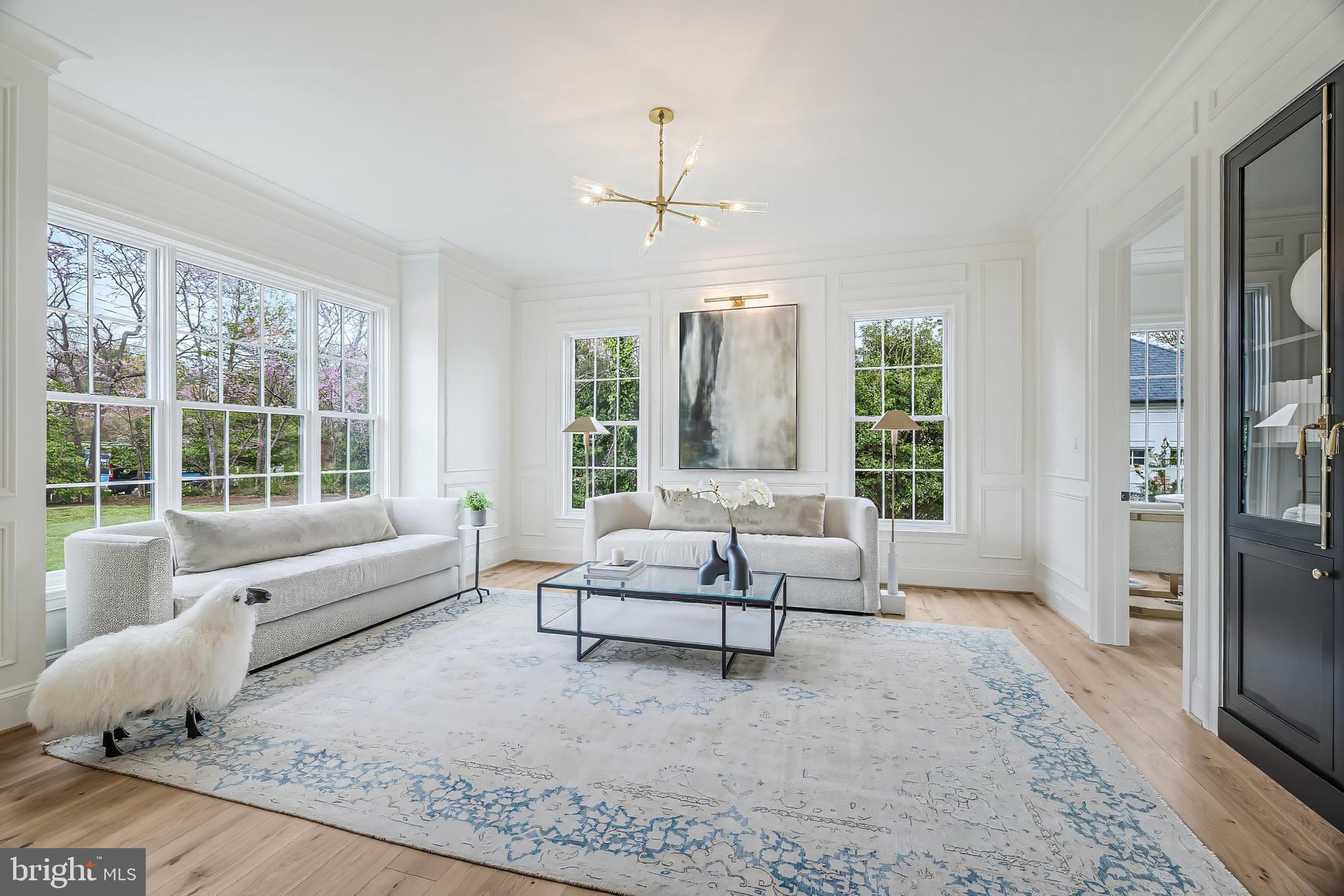 6913 Benjamin Street McLean, VA 22101 - Photo 7 of 51 a living room with furniture and a large window