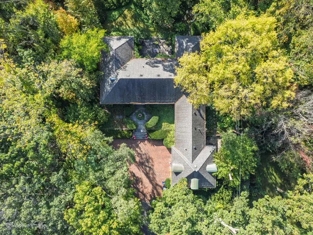 a view of a house with a tree