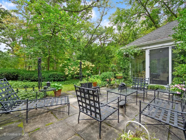 a view of backyard with seating and green space