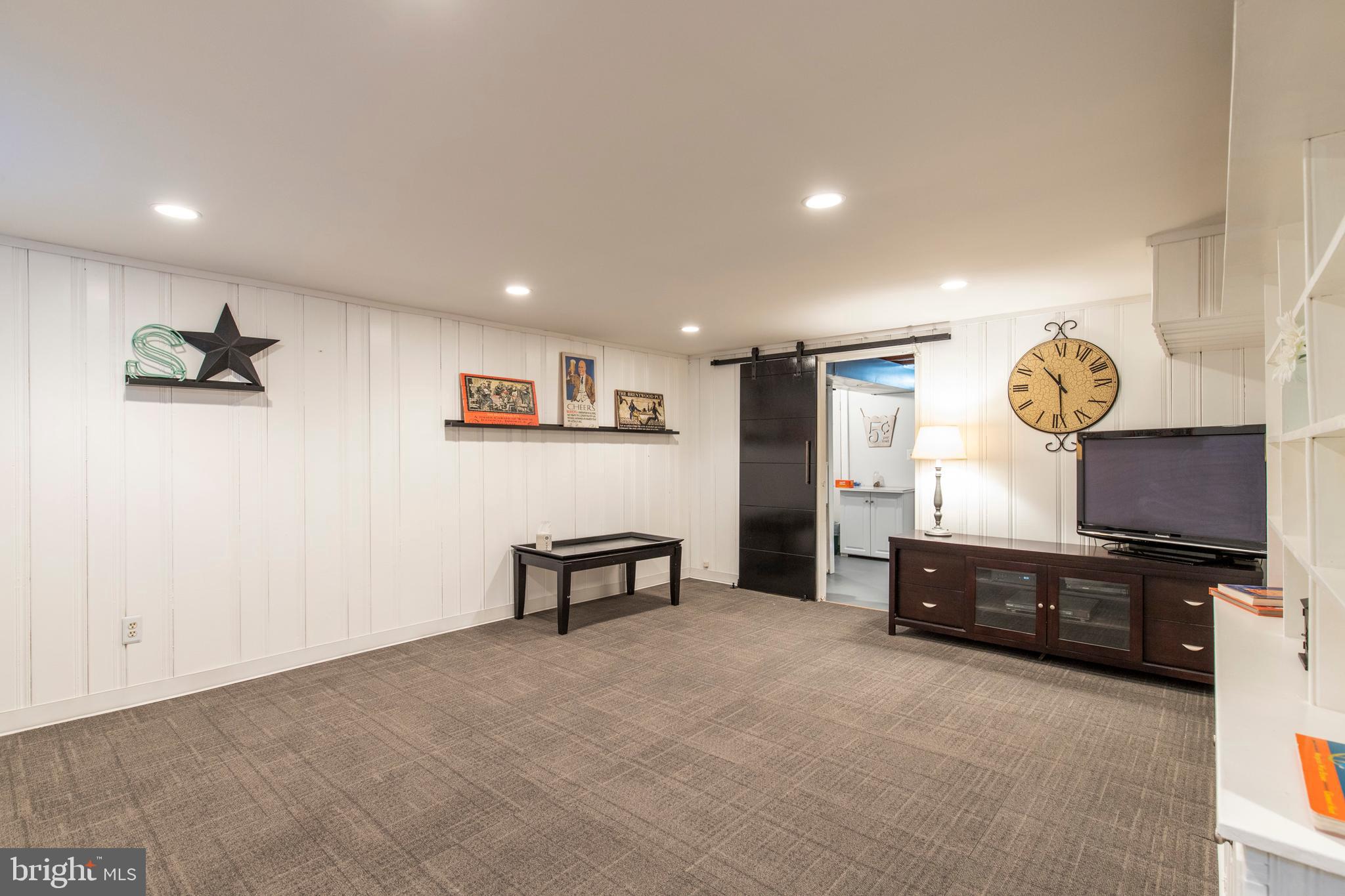 122 Brentwood Road Havertown, PA 19083 - Photo 23 of 31 Finished basement with sliding barn door