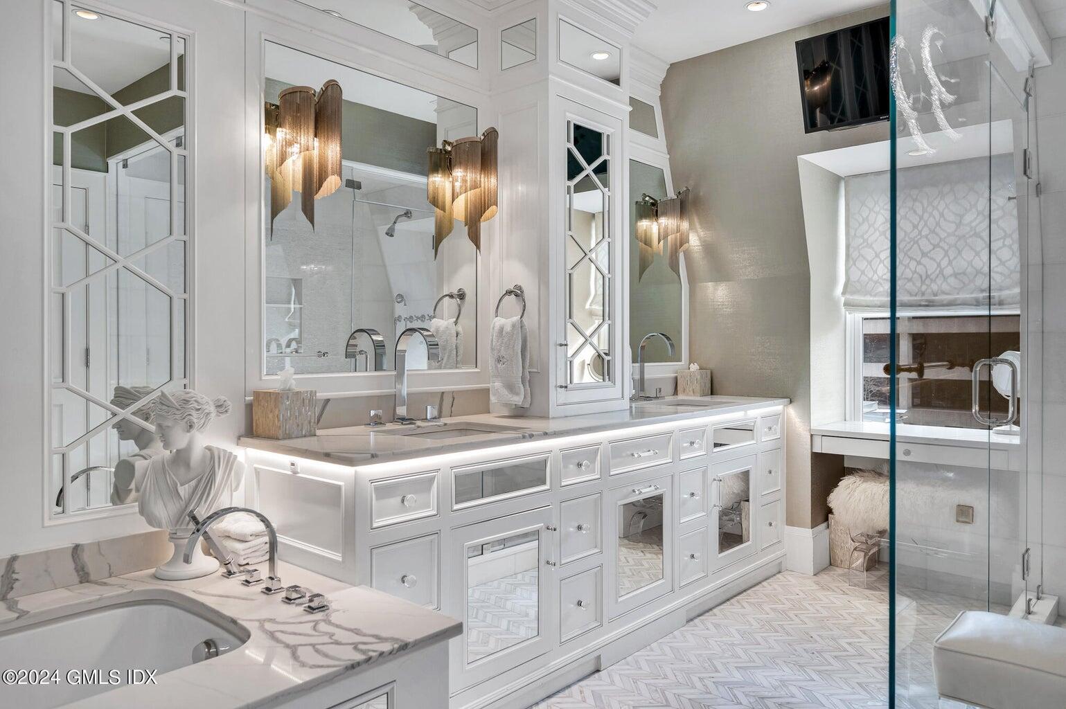 2 Oneida Drive, Unit C2 Greenwich, CT 06830 - Photo 18 of 26 a bathroom with double vanity and a mirror