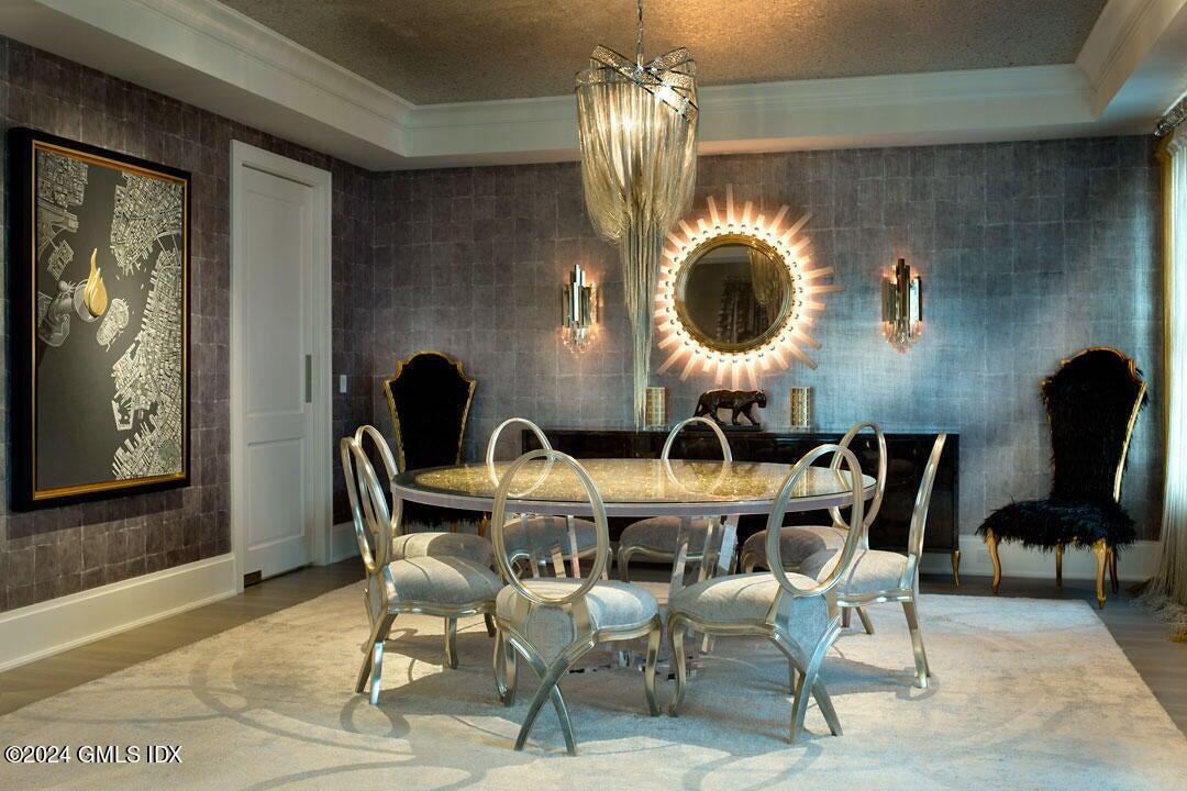 2 Oneida Drive, Unit C2 Greenwich, CT 06830 - Photo 8 of 26 a view of a dining room with furniture and chandelier