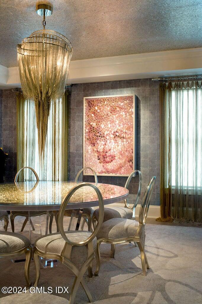 2 Oneida Drive, Unit C2 Greenwich, CT 06830 - Photo 9 of 26 a view of a dining room with furniture window and outside view