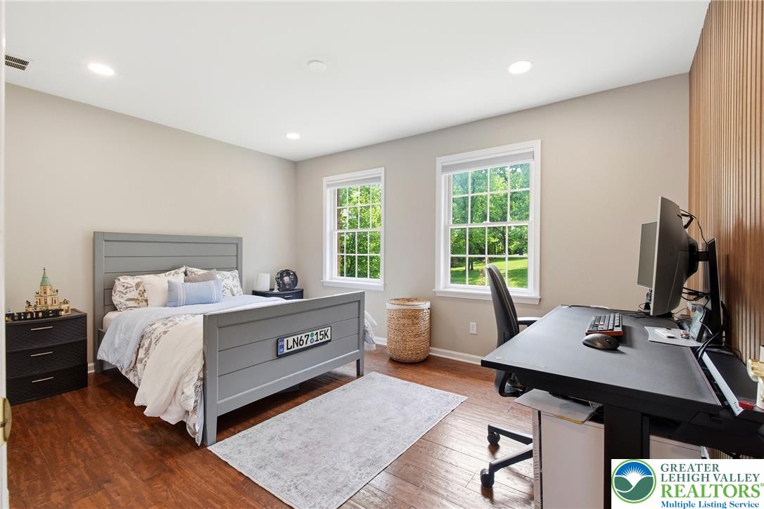 115 West Butternut Road Hellertown, PA 18055 - Photo 48 of 97 Well-lit sleeping quarters with rich hardwood flooring and a dedicated workspace for productivity.